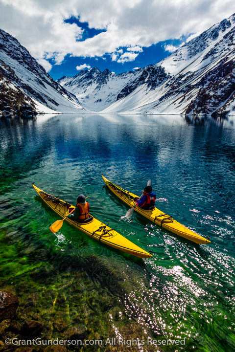 James Heim and Michelle Parker using Kayaks to access skiing on Laguna de Incas in Portillo Chile